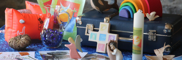 Elemente aus dem blauen Kita-Taufkoffer